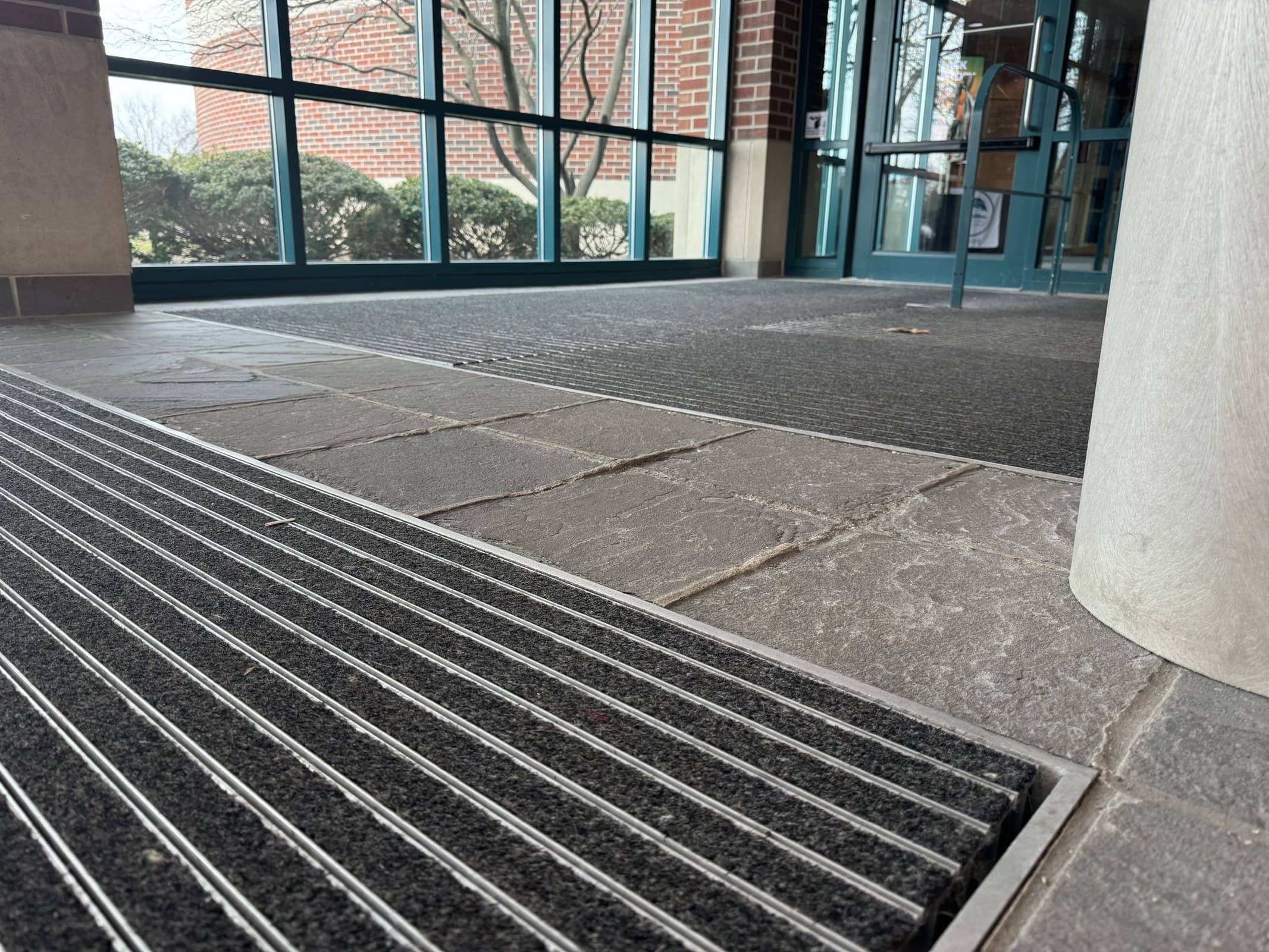 Floor of the library entrance way showing wear and tear of many years.