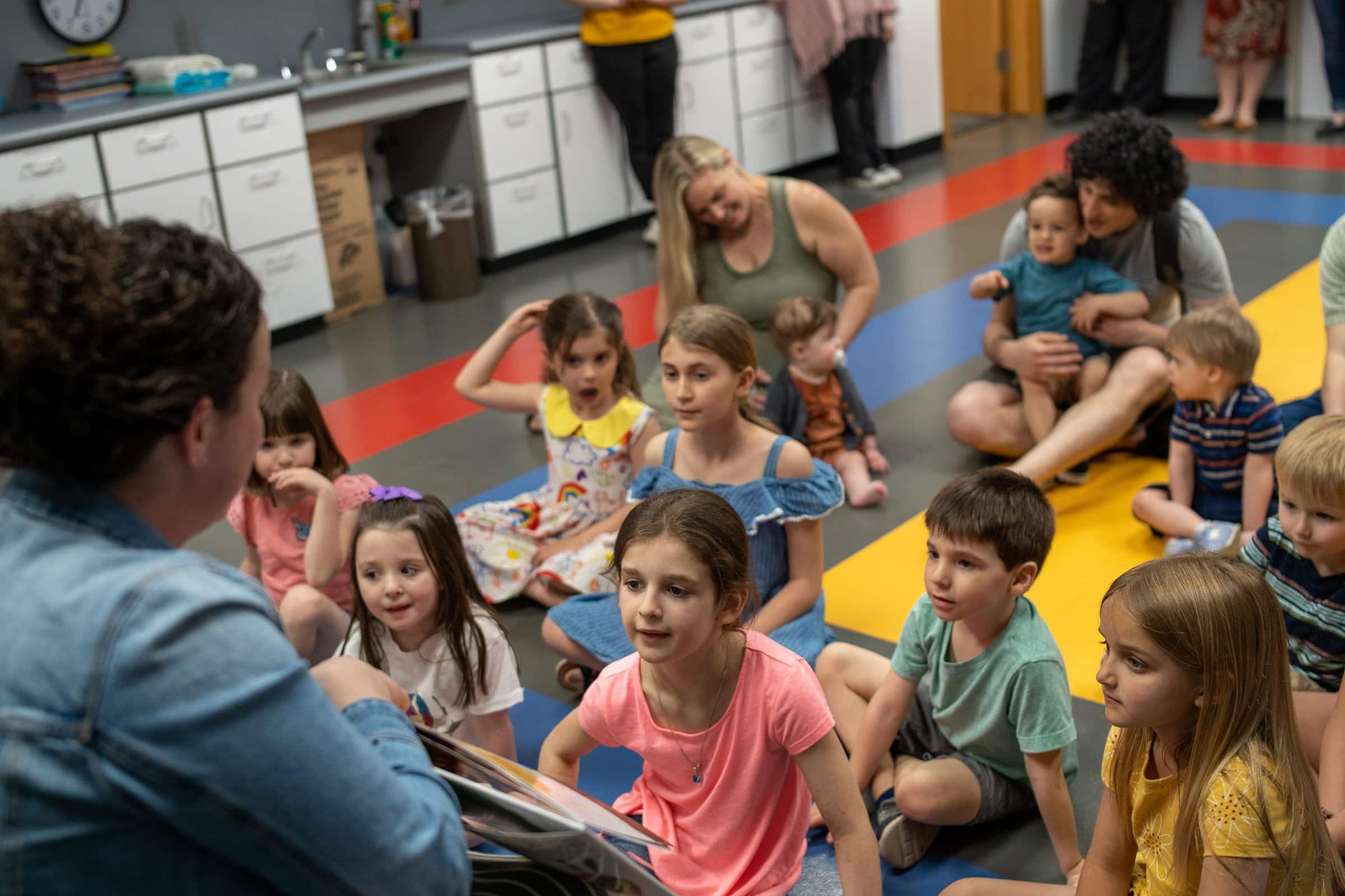Librarian reading to children for storytime