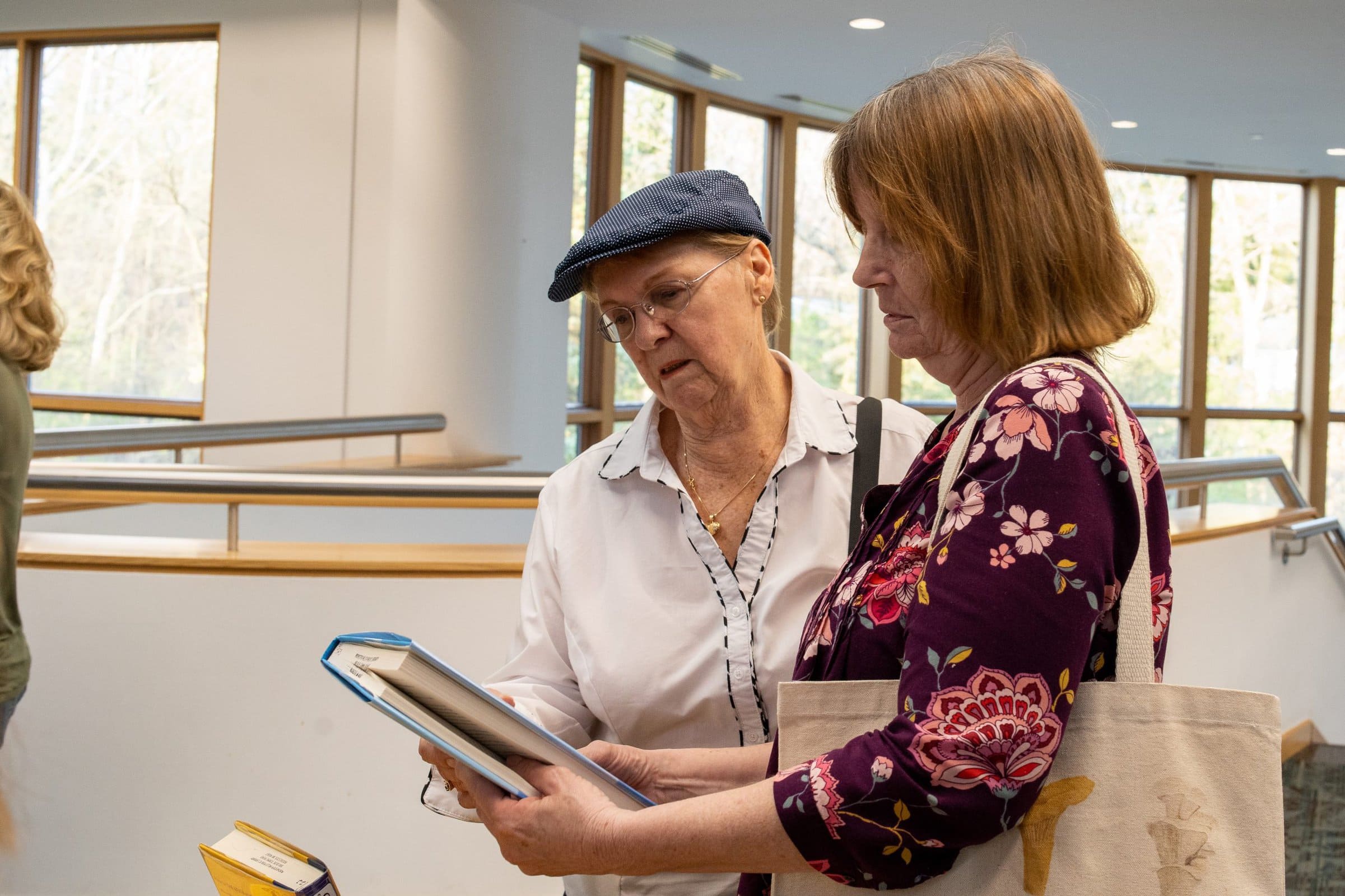 Patrons checking out the RHPL Buzz Reads collection. Buzz Reads includes books from hot topics and rising authors.