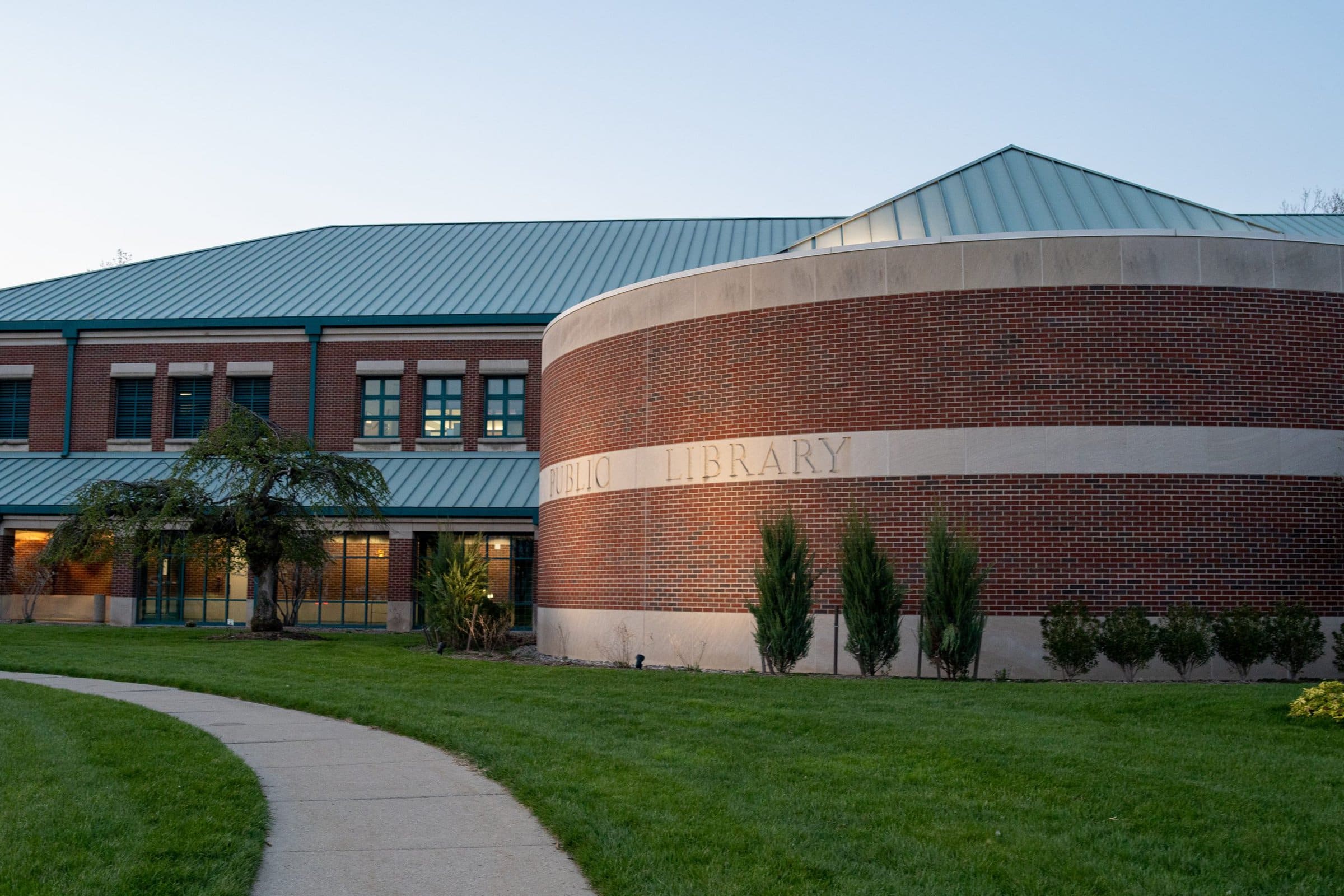 Exterior wall of the library, showing RHPL Tree and Public Library sign